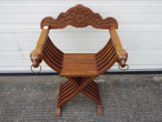 A Savonarola type folding chair, the bac
