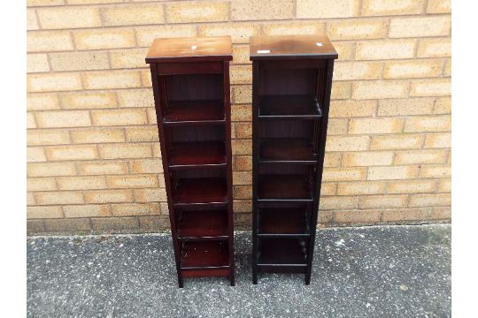 A pair of wooden, freestanding compact d