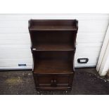 Ercol - A Waterfall bookcase with lower