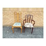 A mahogany armchair with upholstered seat and one other.