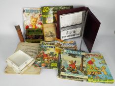 Lot to include Rupert The Bear annuals, binder of first day covers,
