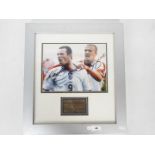 A signed photograph of Wayne Rooney and David Beckham, mounted and framed in glazed display,