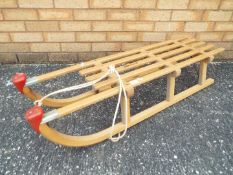 A vintage Pilz Davos wooden sledge,