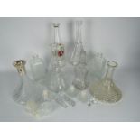 Seven glass decanters.