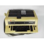 A vintage Olympia International electric typewriter.