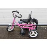Theraplay - A pink IMP disability tricycle.