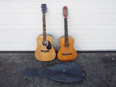 Two acoustic guitars comprising an Encore W255 and a BM, one contained in carry case.