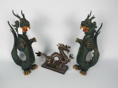 A pair of pottery dragon figurines, approximately 42 cm (h) and a similar cold cast bronze example.