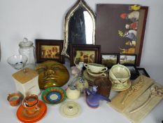 A mixed lot to include shield shaped wall mirror, ceramics, prints, wall art, glassware and similar.