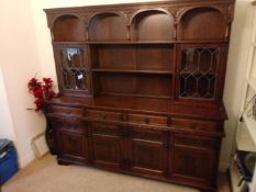 A sideboard / dresser, the lower section with four drawers over two twin door cupboards,
