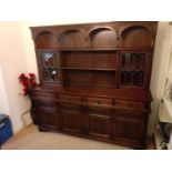 A sideboard / dresser, the lower section with four drawers over two twin door cupboards,