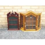 Two wall hanging display cabinets, largest approximately 53 cm x 56 cm x 15 cm.
