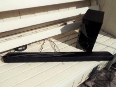 An LG soundbar # NB2540 and subwoofer # S24A1-W with remote