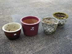 Four circular section garden planters.