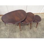 Ercol - A nest of three Pebble occasional tables, largest approximately 40 cm x 66 cm x 46 cm.