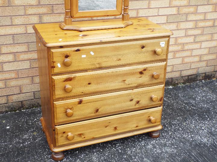 A pine chest of four drawers measuring approximately 85 cm x 86 cm x 46 cm and a pine framed swing - Image 2 of 3