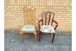 A mahogany armchair with upholstered sea