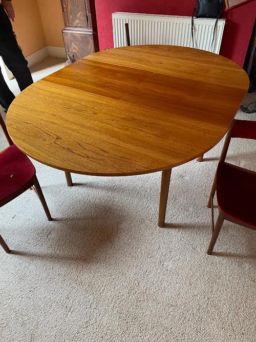 A H McIntosh & Co Ltd - A mid century teak extending dining table measuring approximately 78 cm x