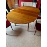 A H McIntosh & Co Ltd - A mid century teak extending dining table measuring approximately 78 cm x