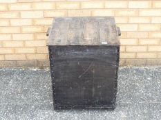 A twin handled, square section, hinge top chest measuring approximately 62 cm x 55 cm x 50 cm.