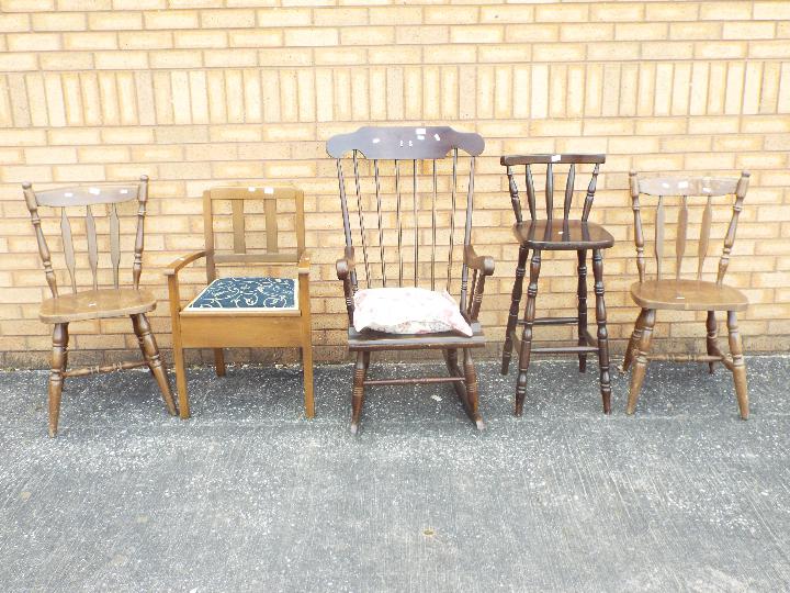 A group of chairs to include rocking chair, pair of kitchen chairs and similar.