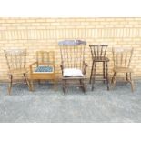 A group of chairs to include rocking chair, pair of kitchen chairs and similar.