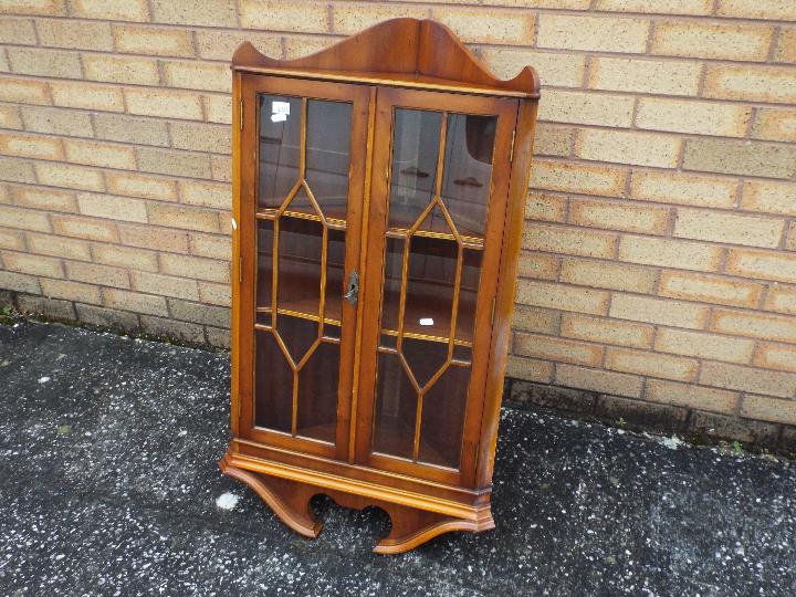 A glazed wall hanging corner cabinet, approximately 105 cm x 58 cm x 32 cm. - Image 2 of 2