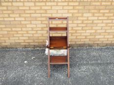 A 20th century metamorphic library chair.