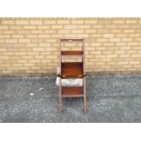 A 20th century metamorphic library chair.