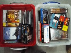 Two boxes of DVD's, feature films, documentaries and similar.