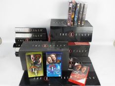 The X Files - Collectors Edition DVDs and ephemera and a quantity of video cassettes.