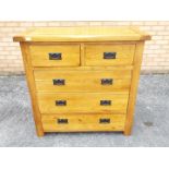 An oak chest of two over three drawers m