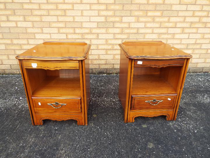 A pair of bedside cabinets measuring approximately 60 cm x 49 cm x 46 cm.