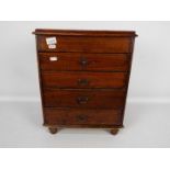Table top chest of drawers measuring approximately 46 cm x 37 cm x 23 cm.