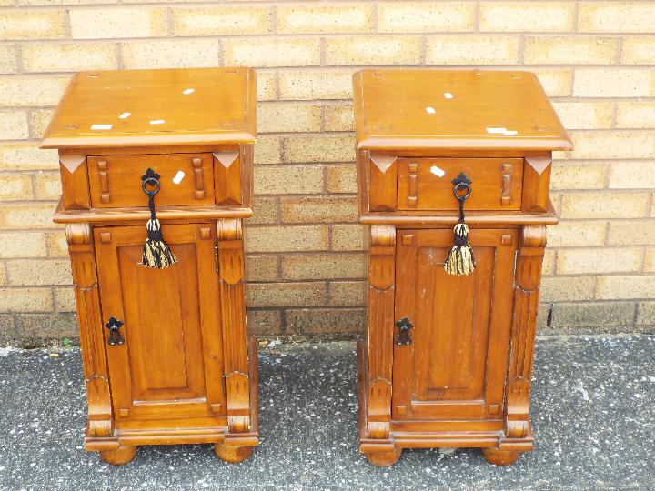 A pair of bedside cabinets measuring approximately 74 cm x 38 cm x 38 cm.