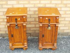 A pair of bedside cabinets measuring approximately 74 cm x 38 cm x 38 cm.