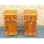 A pair of bedside cabinets measuring approximately 74 cm x 38 cm x 38 cm.