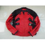 A Genuine Leather motorcycle jacket, red and black, unused surplus retail stock,
