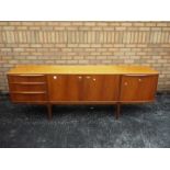 A H McIntosh - A mid century teak sideboard having central twin door cupboard flanked to one side