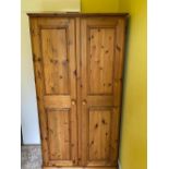 A pine twin door wardrobe measuring approximately 190 cm x 90 cm x 58 cm (dismantled for
