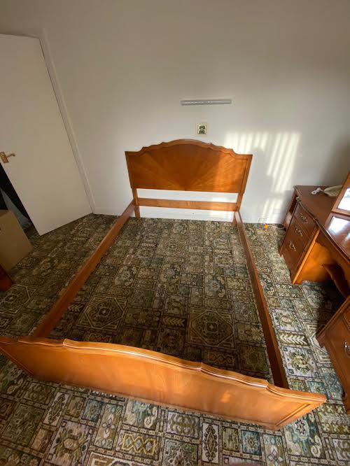 A wooden double bed frame (dismantled for transportation).