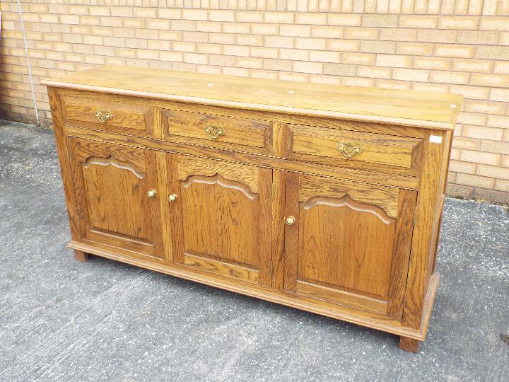 A sideboard with three short drawers ove - Image 2 of 2