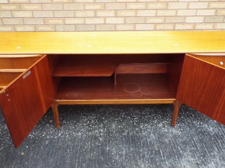 A H McIntosh - A mid century teak sideboard having central twin door cupboard flanked to one side - Image 4 of 5