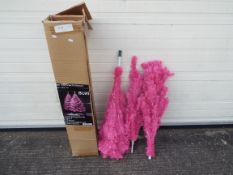 A 6 foot pink unlit Christmas tree. Please note the picture is an example of the tree decorated.