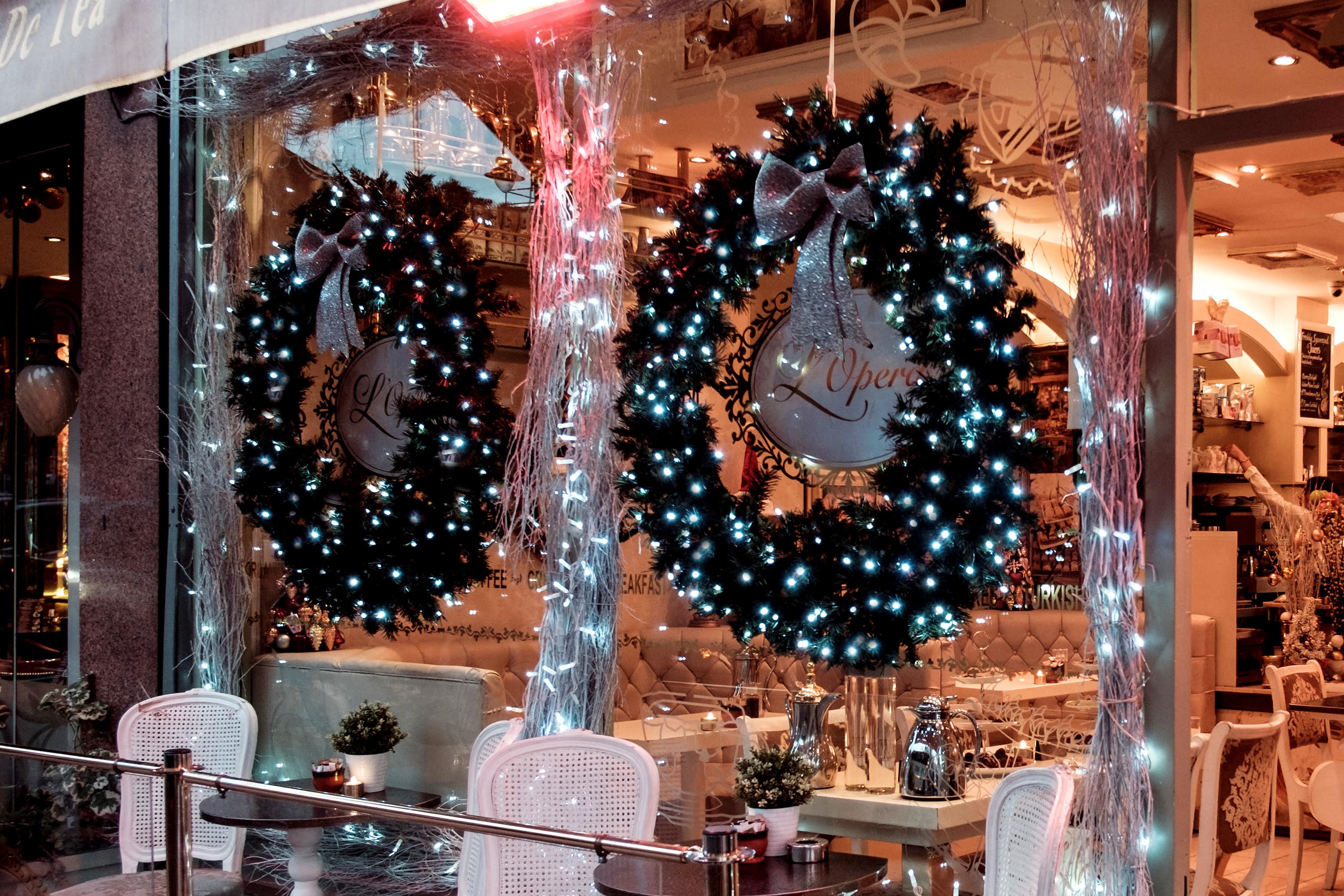 A 3 foot frosty wreath illuminated with warm white lights.