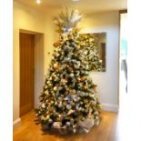 A 6 foot green Christmas tree illuminated with ice white lights.