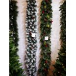 Six 8 foot frosty garlands illuminated with warm white lights with 3 plugs.