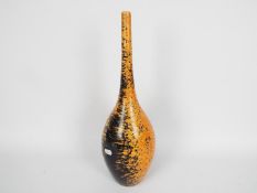 John Nuttgens - A large 20th century bottle vase in a vibrant orange colour with black speckling,