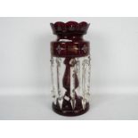 A Victorian ruby glass lustre with clear glass drops, approximately 35 cm (h).