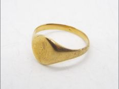 Yellow metal ring, unmarked, size X, approximately 5.8 grams all in.